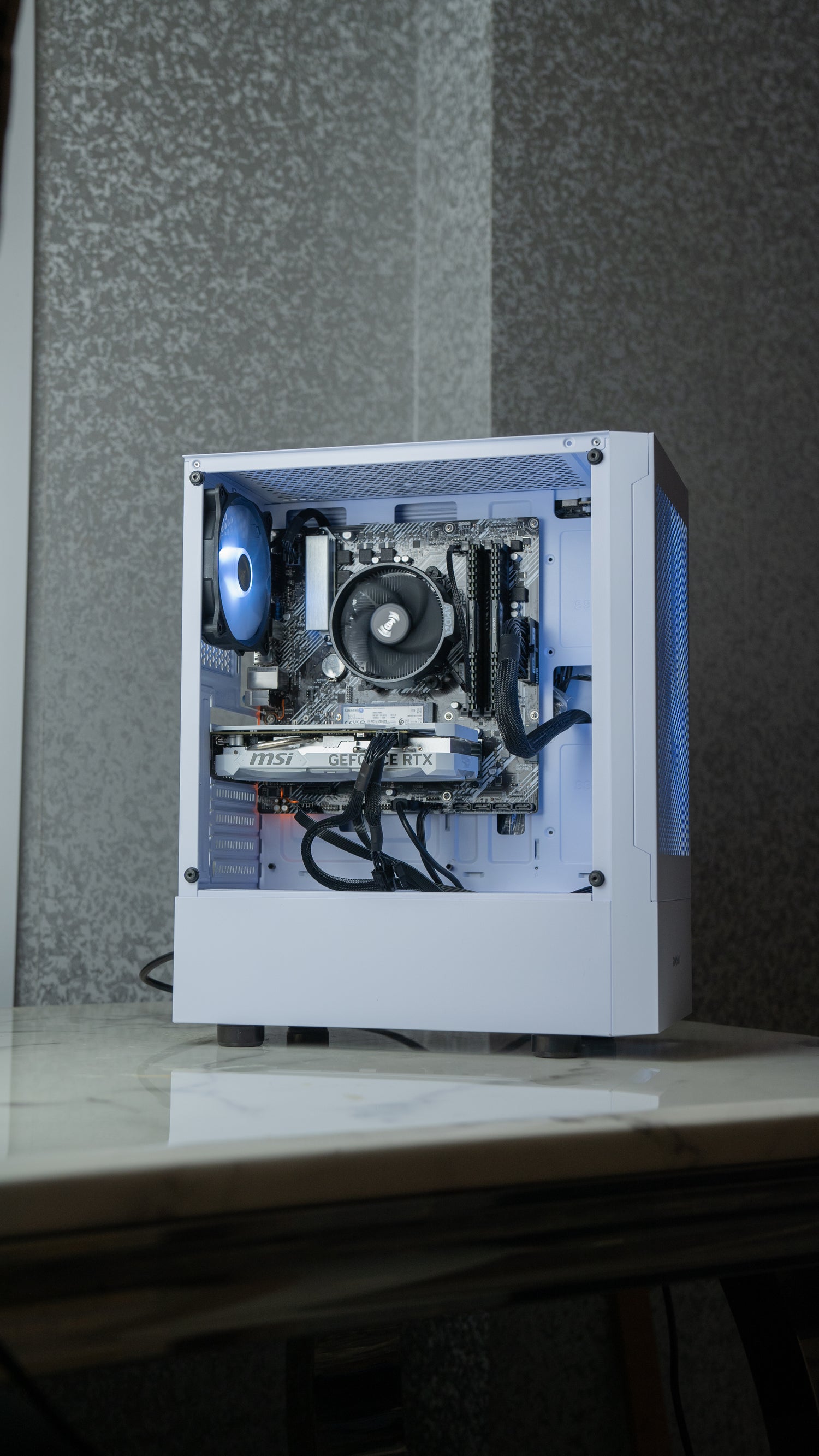 All white gaming pc with a white graphics card and rgb lighting